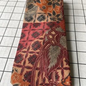 Armadillo, Han Mack Seoul tie, multi colored, orange/green hues, paisley motif